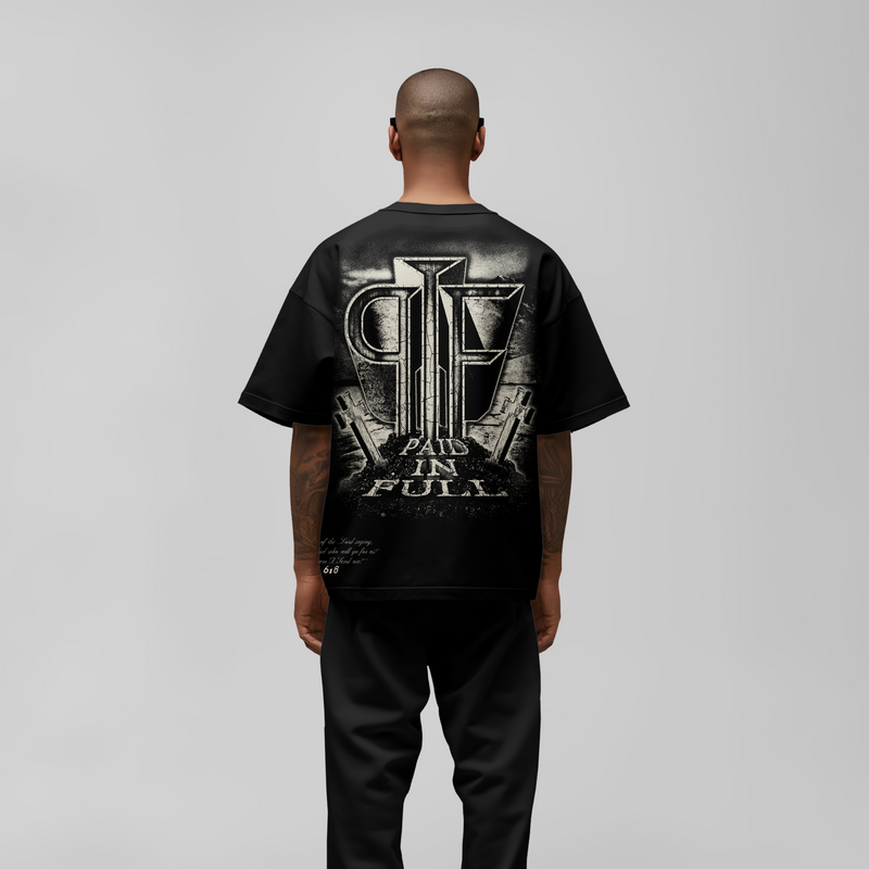 Back view of black 'Paid in Full' Christian t-shirt featuring bold cross-inspired typography and streetwear design